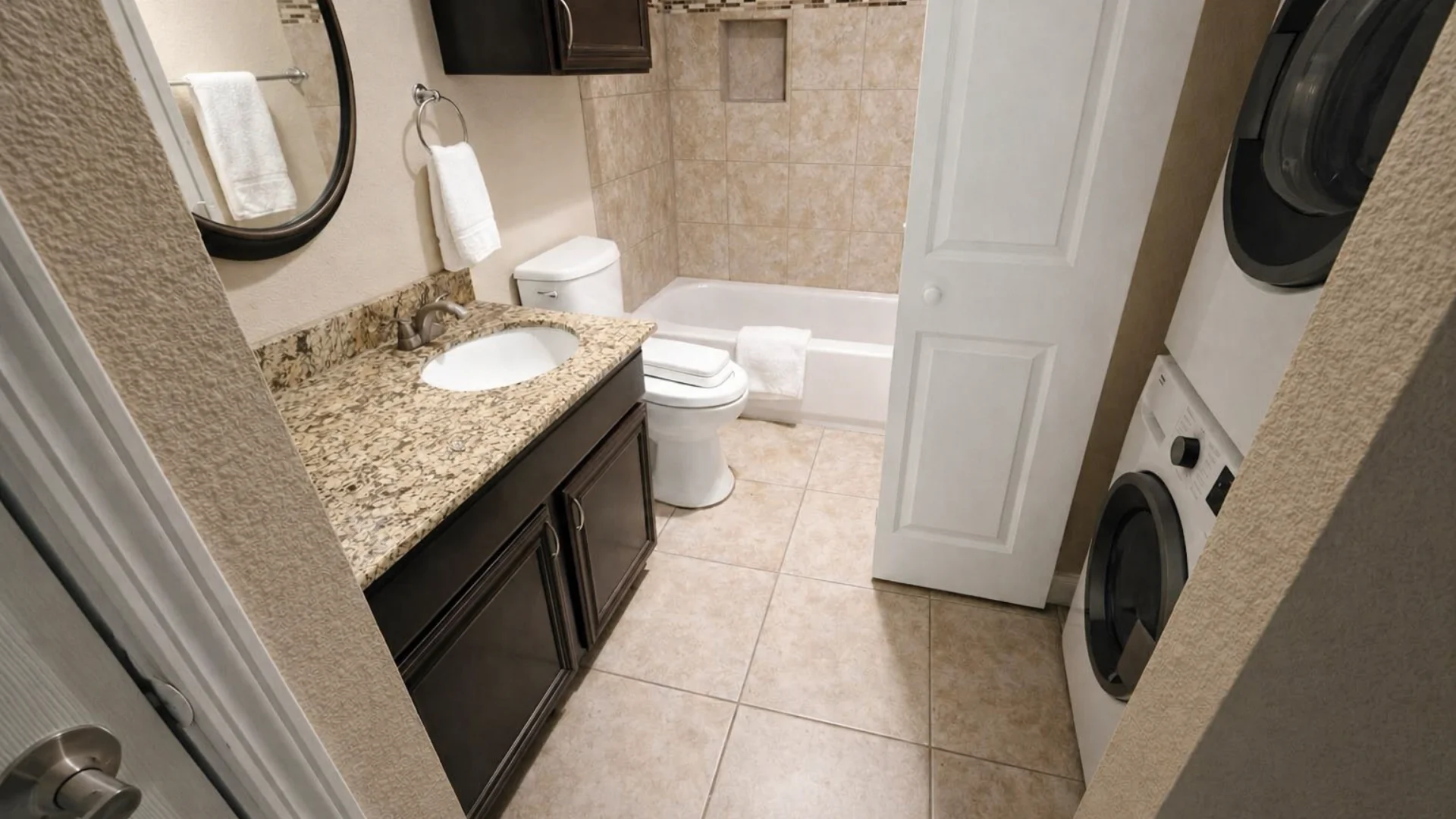 A clean full bathroom and laundry room thoroughly disinfected through facility sanitation services in Cedar Park.